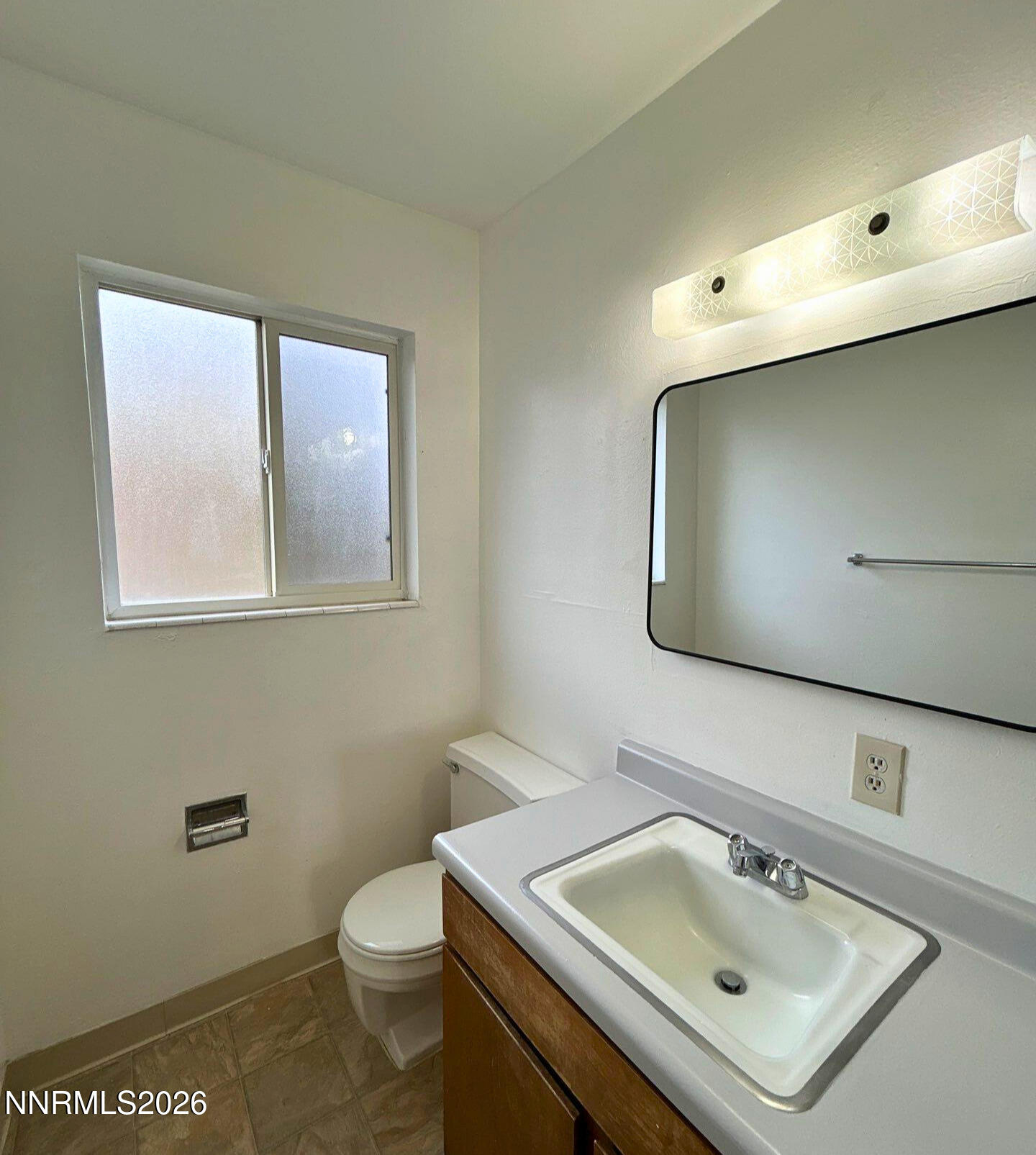 3285 Gypsum Road Reno, NV 89503 - Photo 8 of 17 a bathroom with a sink toilet and mirror