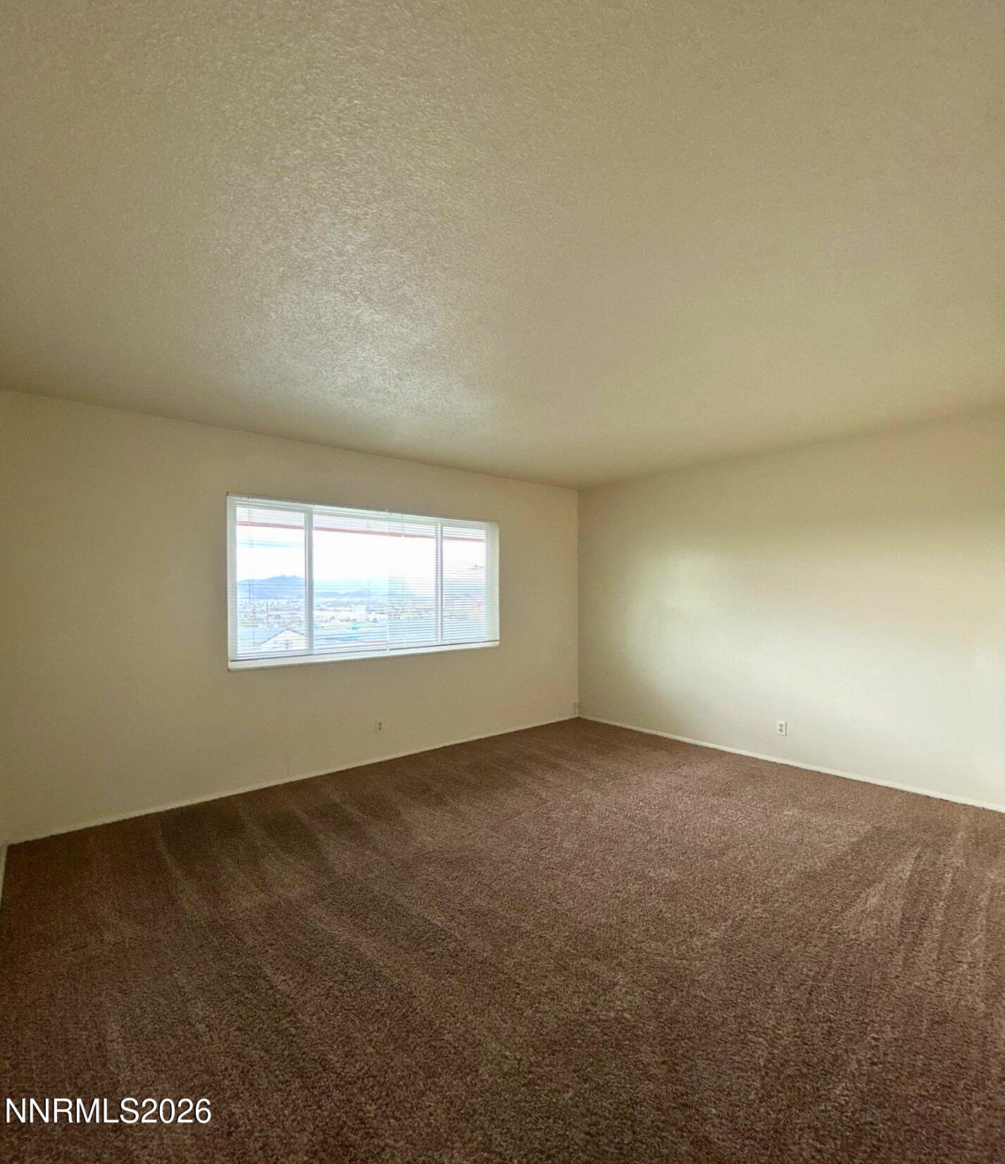 3285 Gypsum Road Reno, NV 89503 - Photo 9 of 17 an empty room with windows