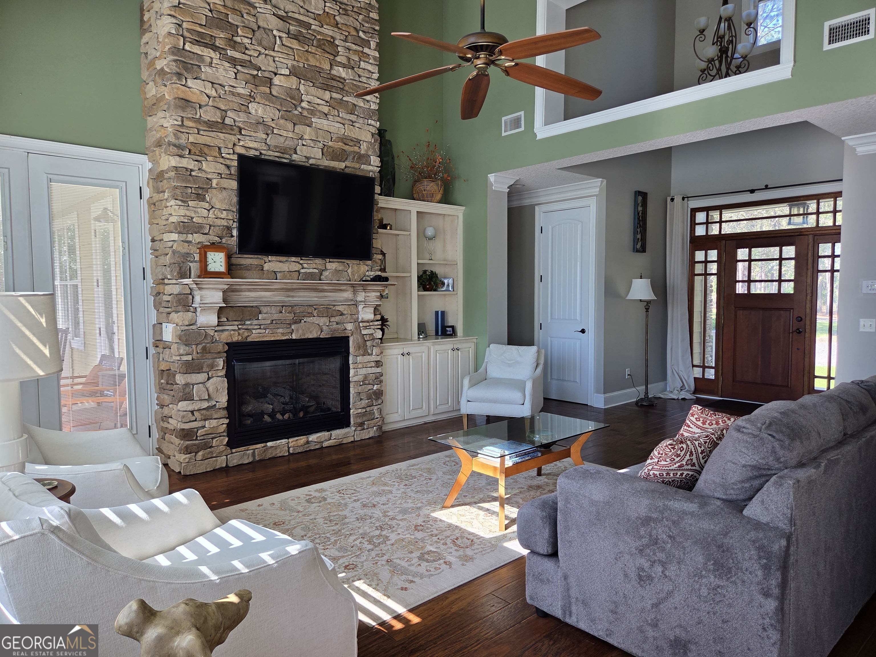 300 Hammond Powell Road Hazlehurst, GA 31539 - Photo 38 of 91 a living room with furniture a flat screen tv and a fireplace