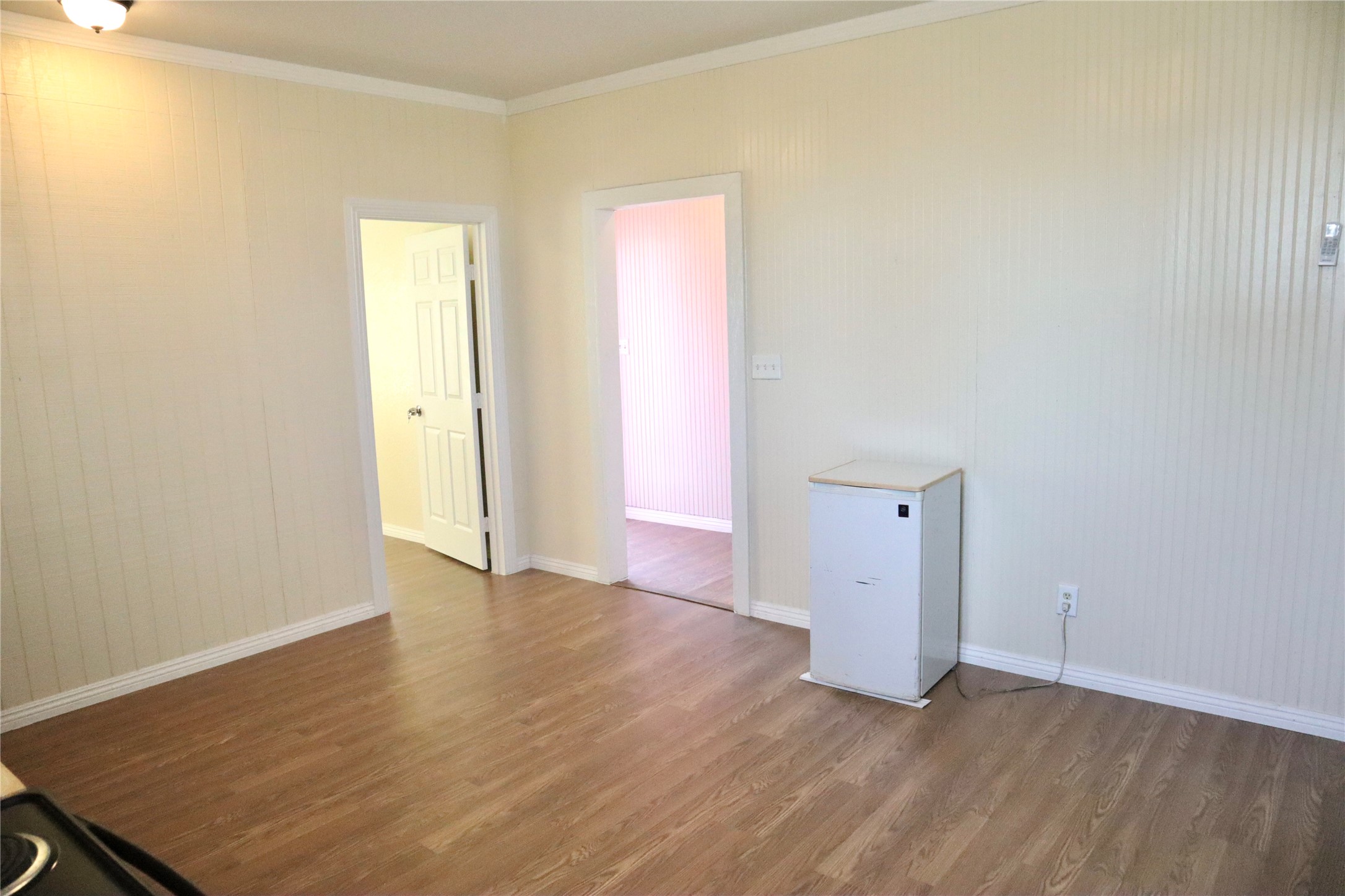 2689 County Road 32 Angleton, TX 77515 - Photo 12 of 15 a view of an empty room with wooden floor