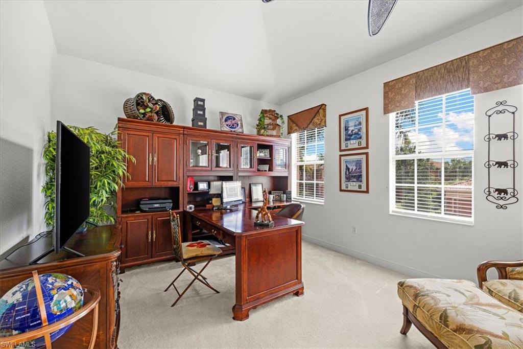 6443 Legacy Circle, Unit 1103 Naples, FL 34113 - Photo 25 of 35 a view of a workspace with furniture and toys