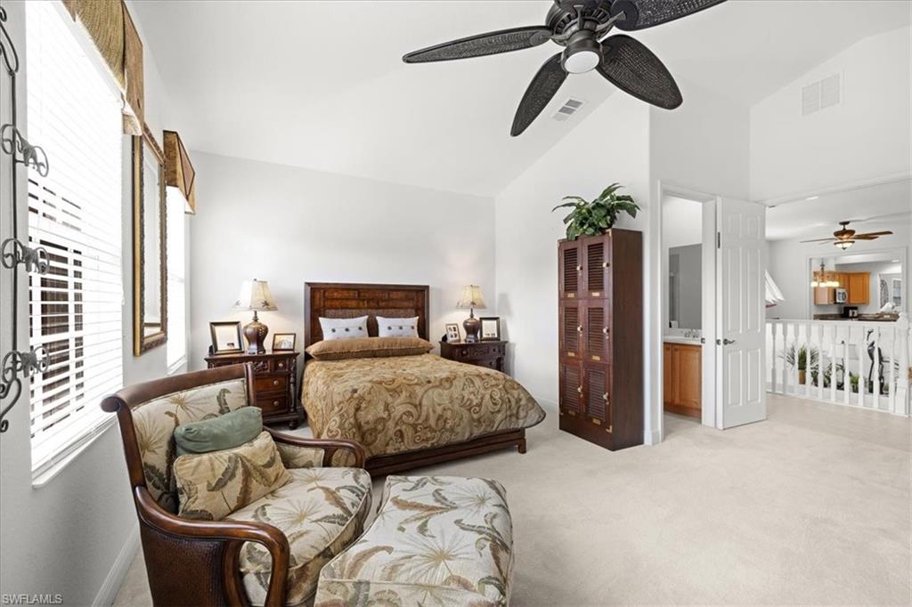6443 Legacy Circle, Unit 1103 Naples, FL 34113 - Photo 27 of 35 a bedroom with furniture and a window