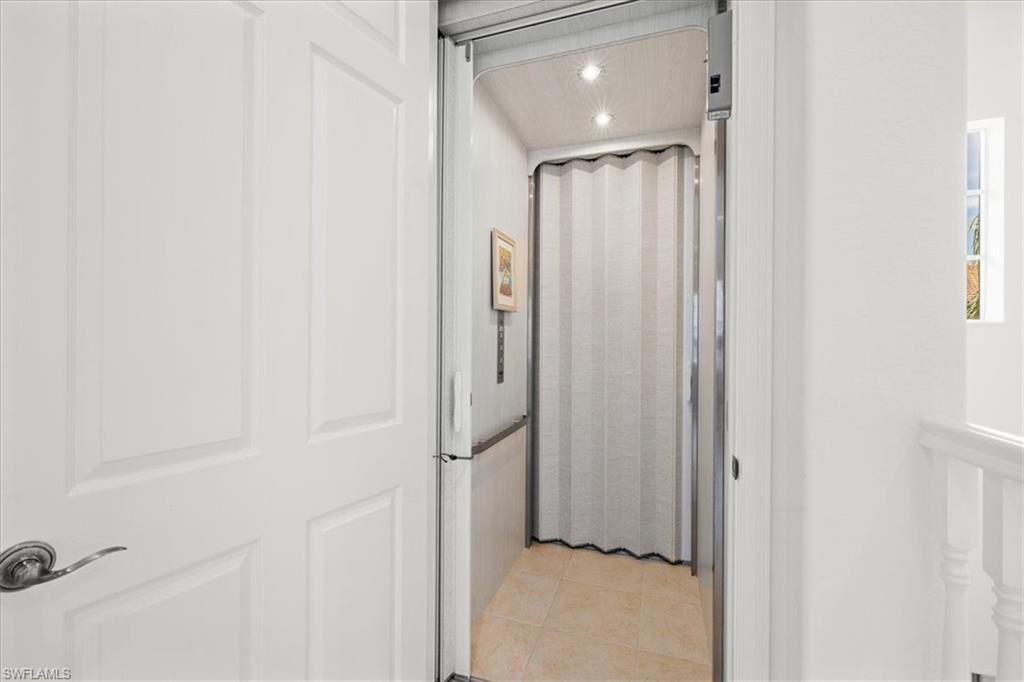 6443 Legacy Circle, Unit 1103 Naples, FL 34113 - Photo 32 of 35 a view of hallway with shower