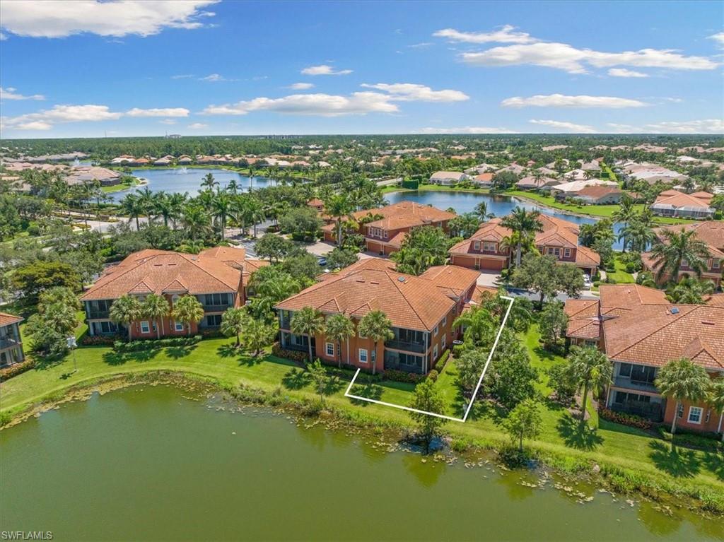 6443 Legacy Circle, Unit 1103 Naples, FL 34113 - Photo 4 of 35 a view of a city with a building in the background