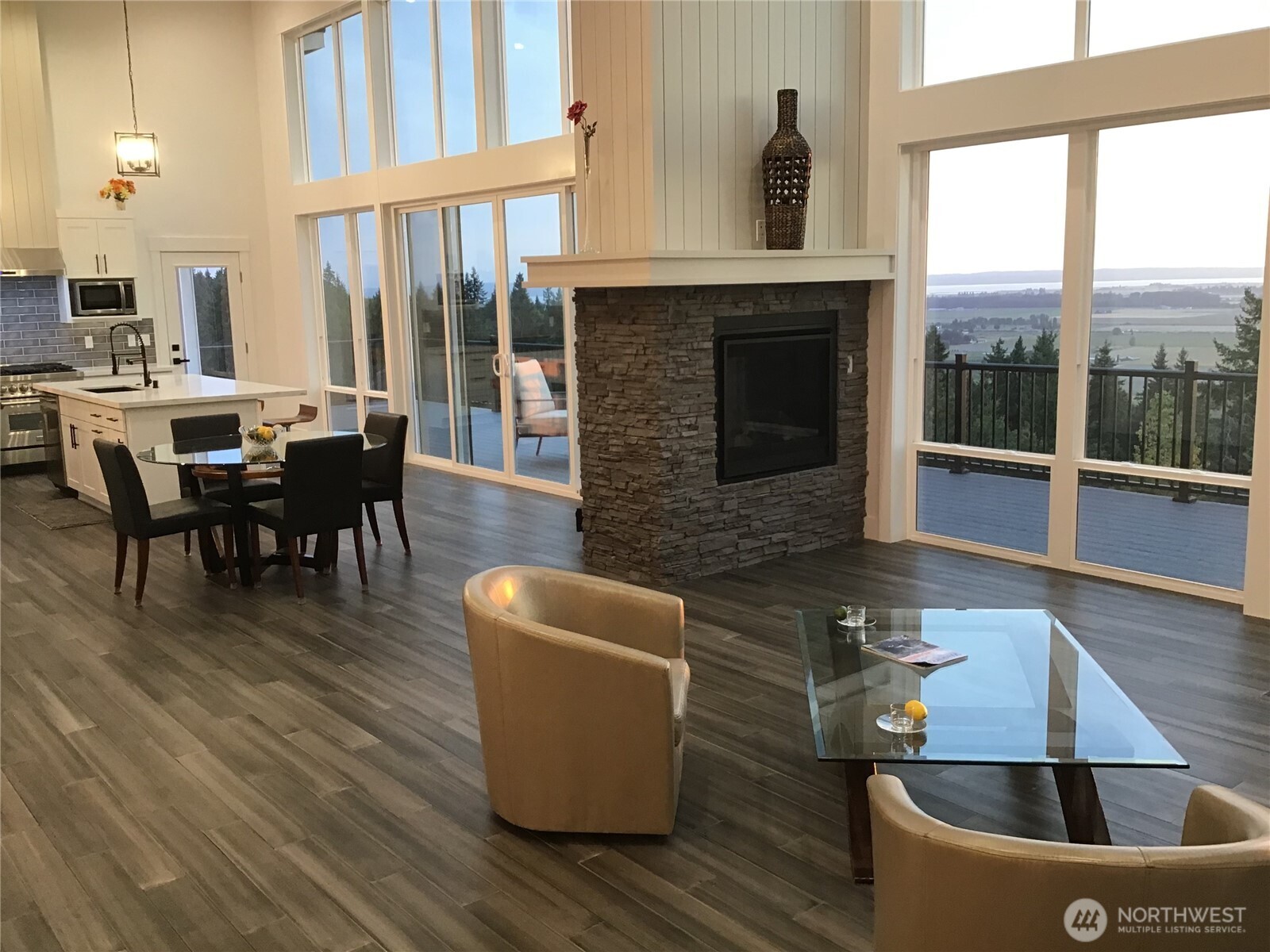 20555 Benson Ridge Mount Vernon, WA 98274 - Photo 5 of 40 a dining room with furniture a fireplace and wooden floor