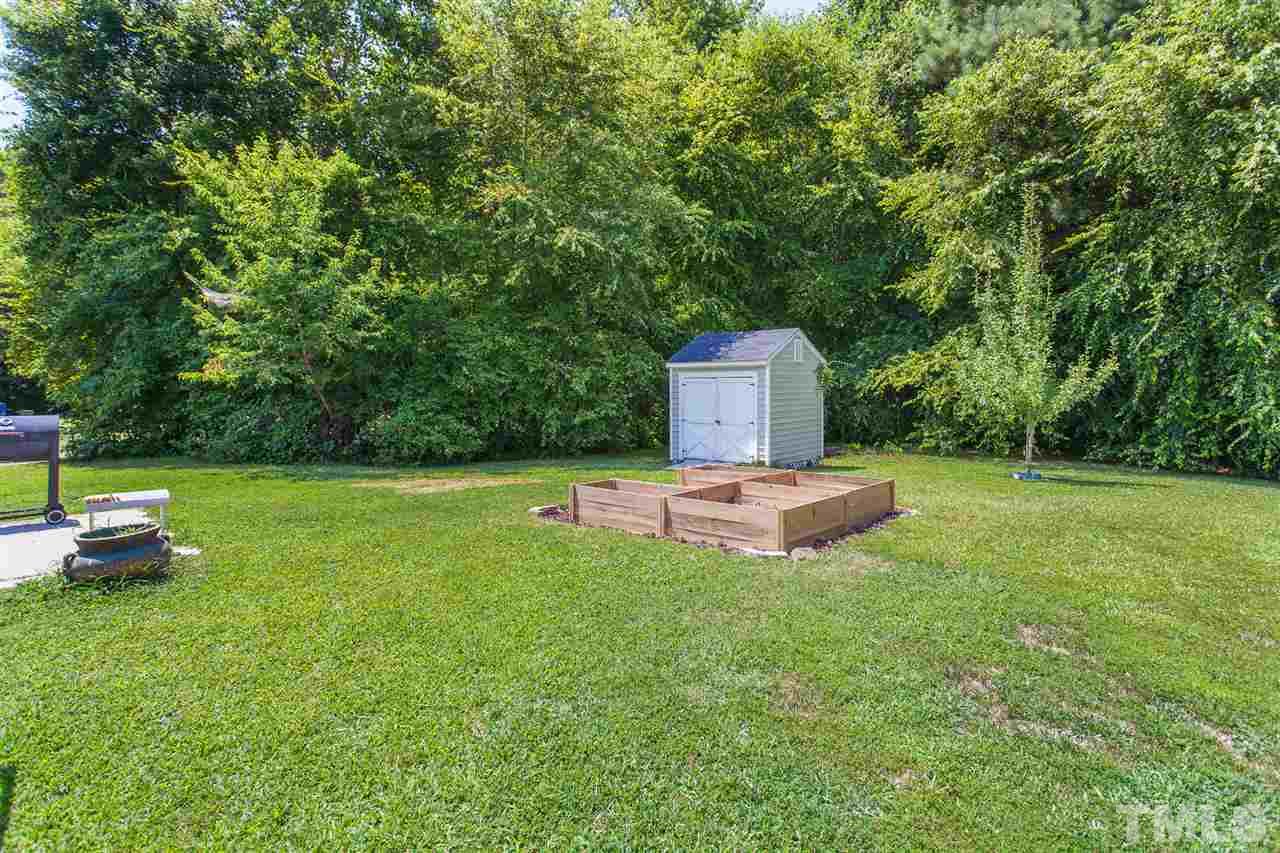 4040 Pearl Road Raleigh, NC 27610 - Photo 13 of 15 The backyard is so nice and backs to wooded area.