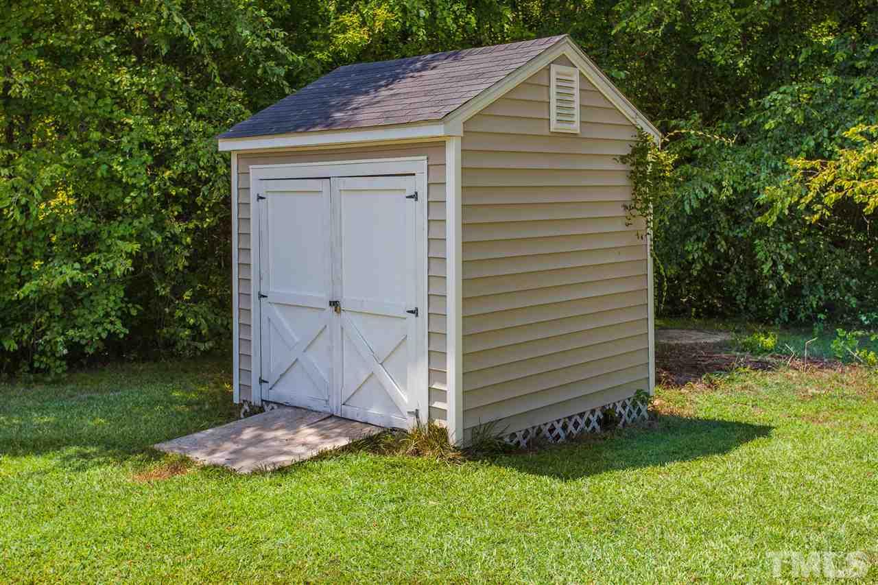 4040 Pearl Road Raleigh, NC 27610 - Photo 14 of 15 Shed is large enough to store mower and have some extra storage space