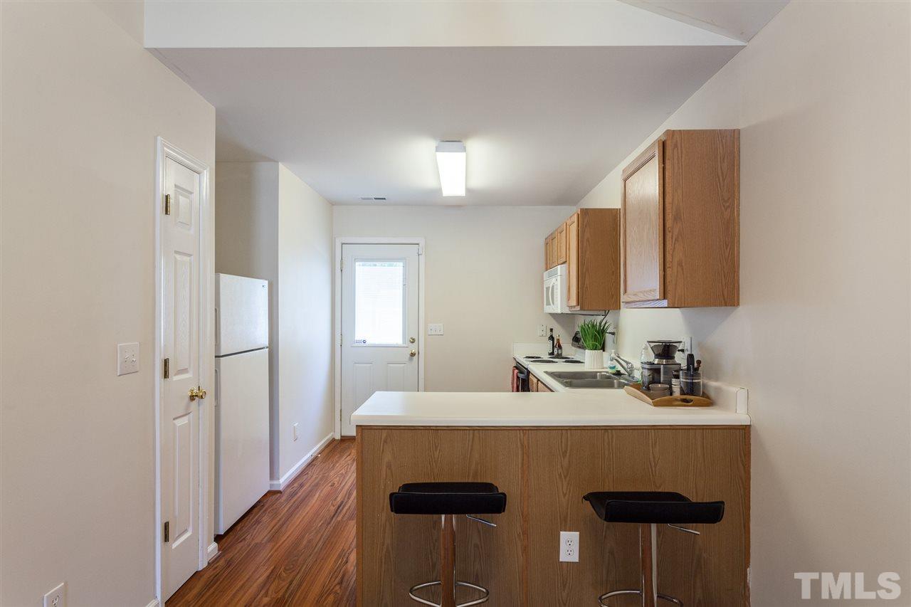 4040 Pearl Road Raleigh, NC 27610 - Photo 4 of 15 Kitchen has ample cabinets, counter space and a pantry