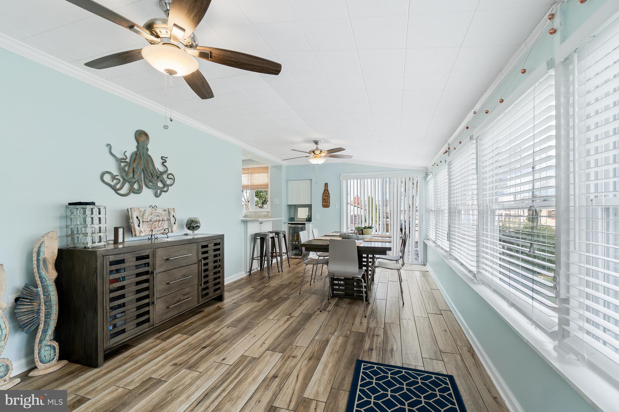 76 Bluff Road Earleville, MD 21919 - Photo 11 of 16 a living room with furniture and a large window