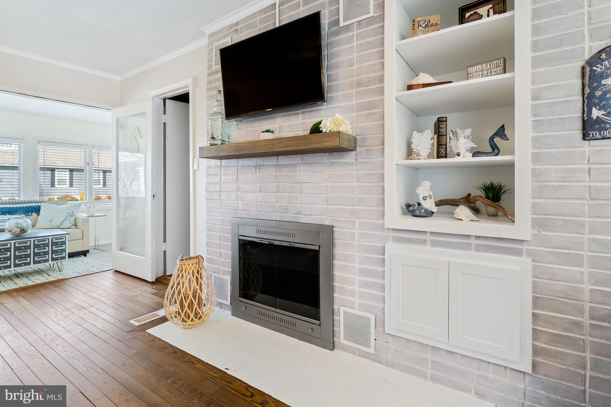 76 Bluff Road Earleville, MD 21919 - Photo 12 of 16 a living room with furniture and a fireplace
