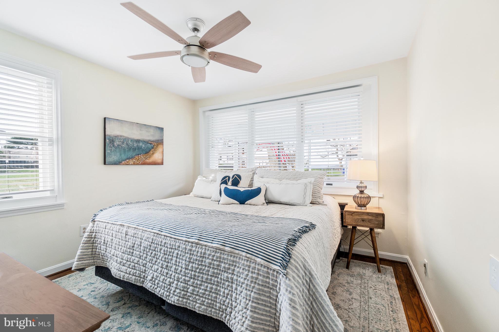 76 Bluff Road Earleville, MD 21919 - Photo 15 of 16 a bedroom with a bed and a table in it with window