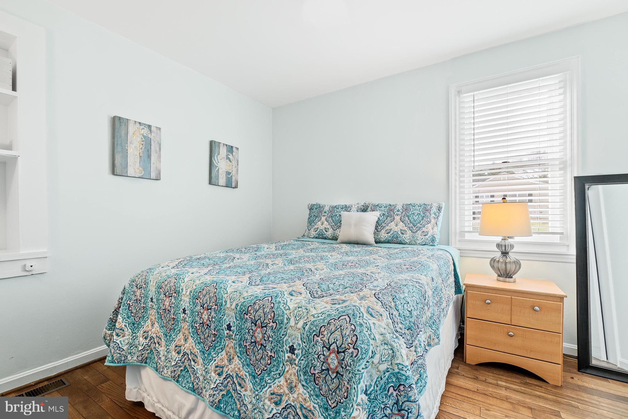76 Bluff Road Earleville, MD 21919 - Photo 16 of 16 a bedroom with a bed and wooden floor