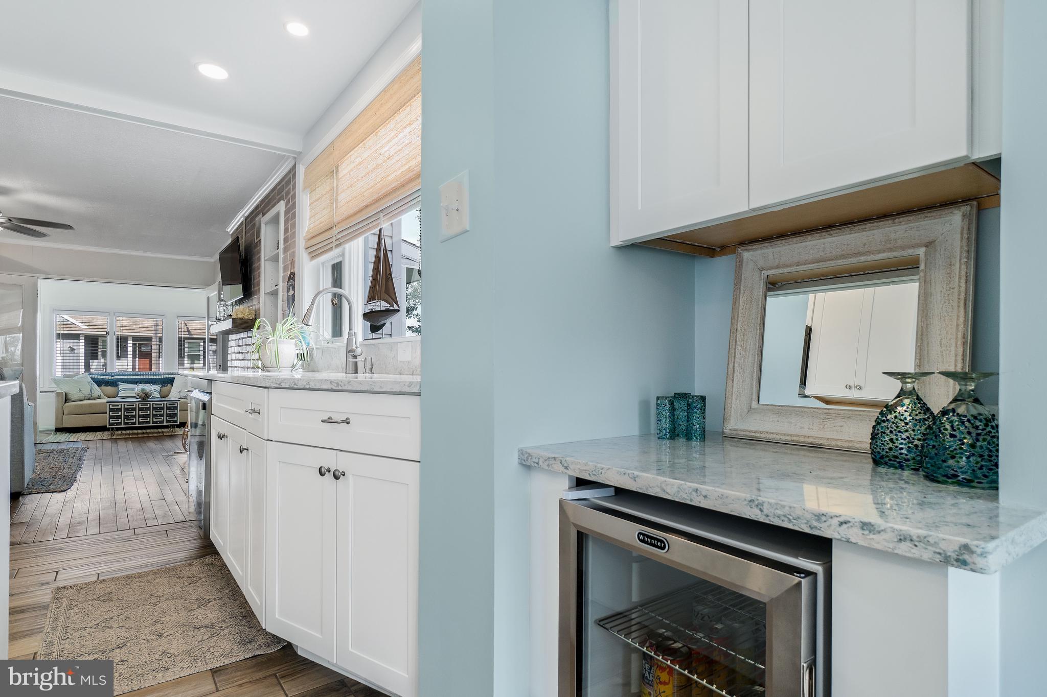 76 Bluff Road Earleville, MD 21919 - Photo 7 of 16 a kitchen with sink cabinets and stove