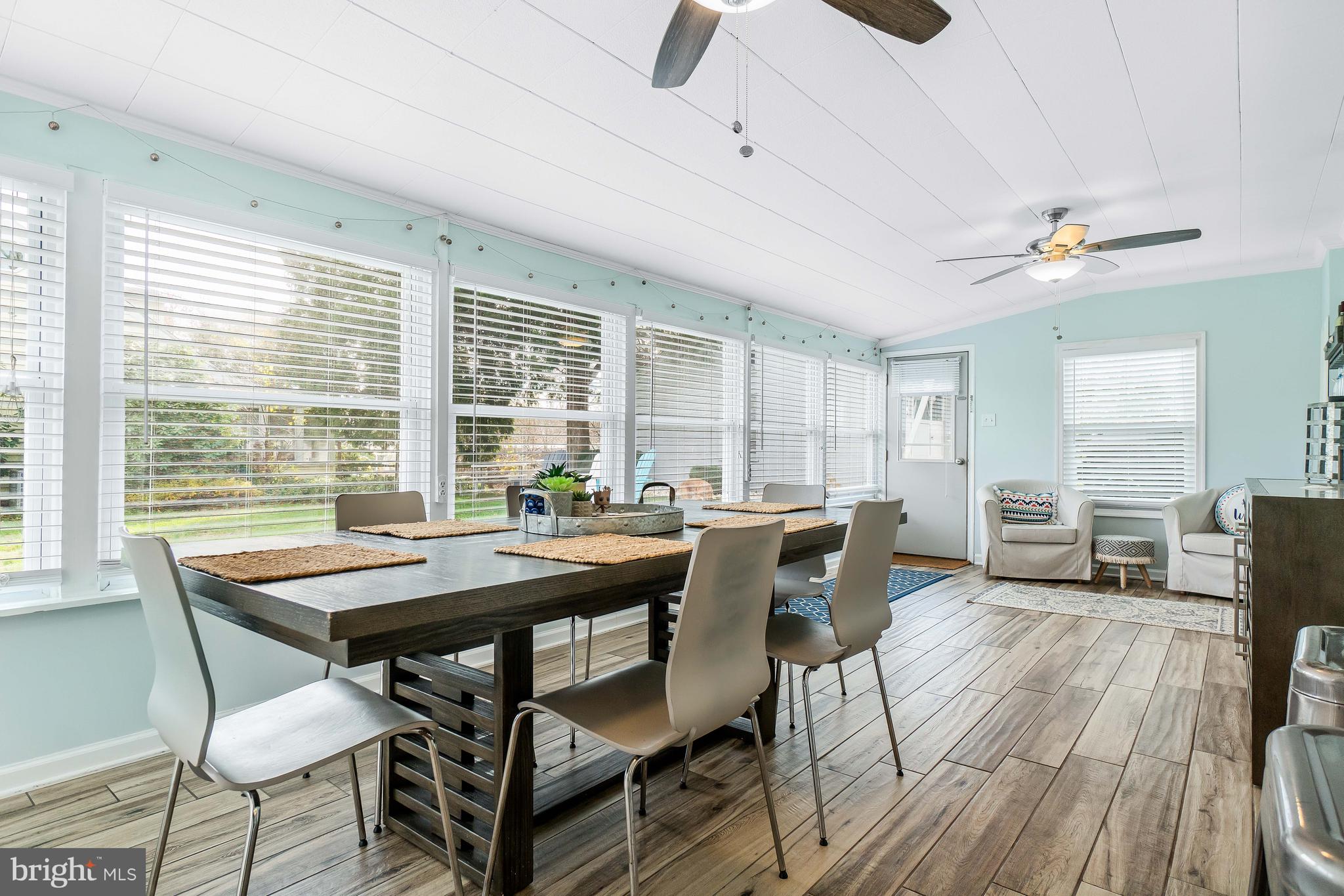 76 Bluff Road Earleville, MD 21919 - Photo 8 of 16 a view of a dining room with furniture window and outside view