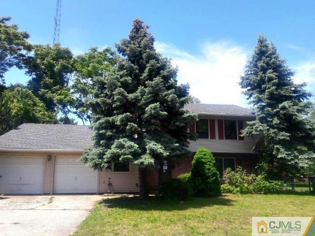 18 Ash Road Edison, NJ 08817 - Photo 1 of 25 a front view of a house with a yard