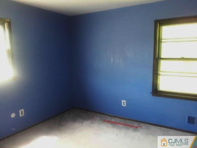 18 Ash Road Edison, NJ 08817 - Photo 14 of 25 a view of an empty room and a window