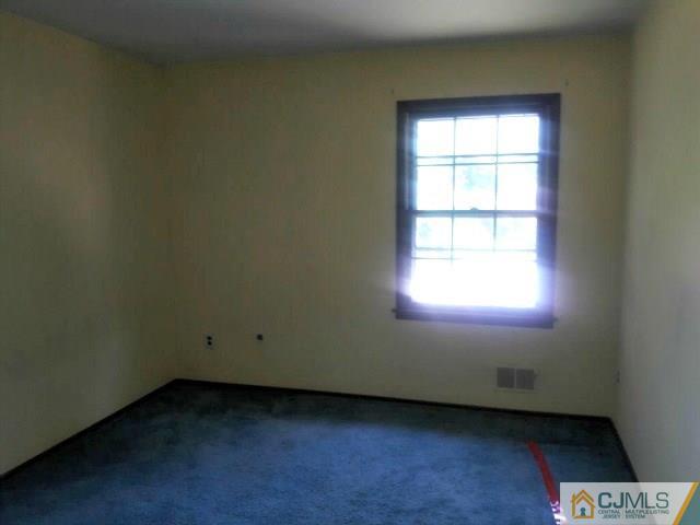 18 Ash Road Edison, NJ 08817 - Photo 16 of 25 an empty room with a window
