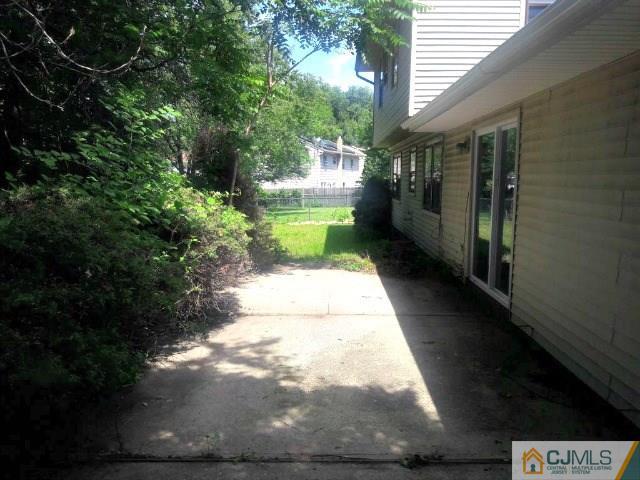 18 Ash Road Edison, NJ 08817 - Photo 23 of 25 a view of a pathway both side of the house