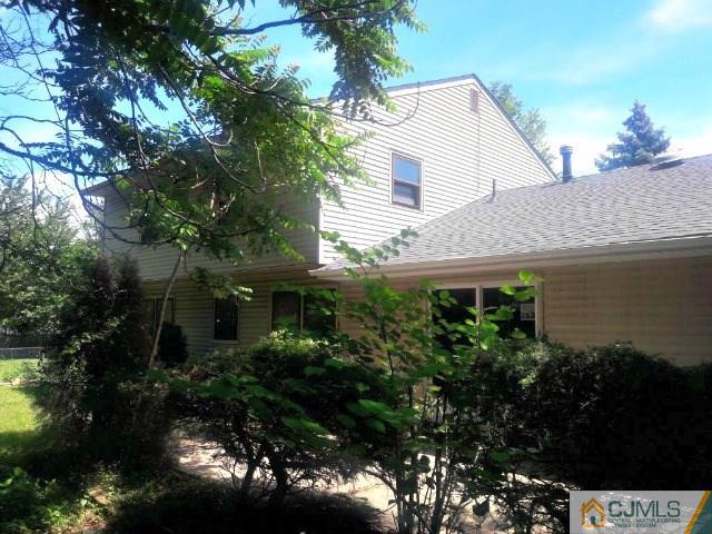 18 Ash Road Edison, NJ 08817 - Photo 24 of 25 a front view of house with green space