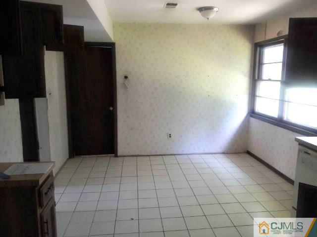 18 Ash Road Edison, NJ 08817 - Photo 9 of 25 a view of an empty room and window