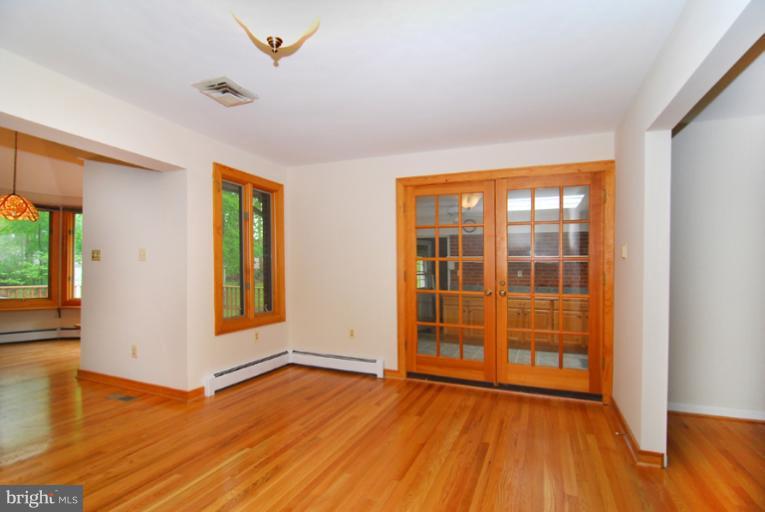 6425 Lignum Street Springfield, VA 22150 - Photo 2 of 30 wooden floor in an empty room with a window