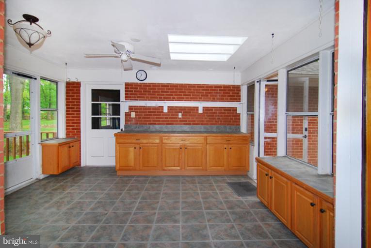 6425 Lignum Street Springfield, VA 22150 - Photo 17 of 30 a view of a kitchen with a sink and windows