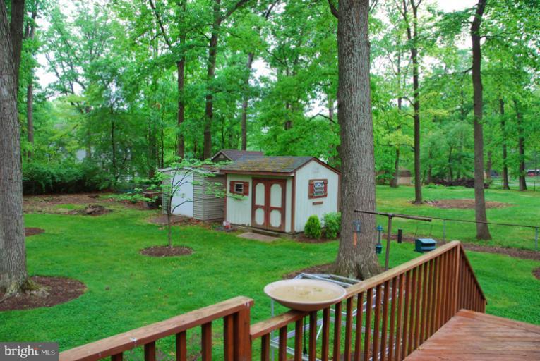 6425 Lignum Street Springfield, VA 22150 - Photo 19 of 30 a view of a deck and a backyard
