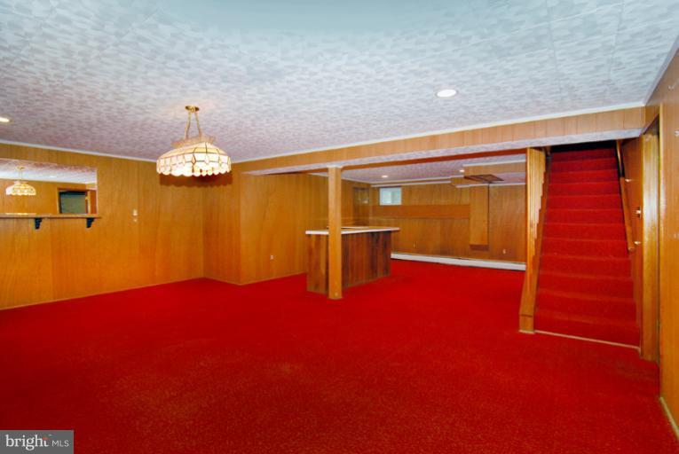 6425 Lignum Street Springfield, VA 22150 - Photo 28 of 30 a view of empty room with furniture and chandelier
