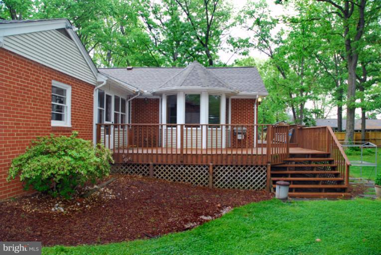 6425 Lignum Street Springfield, VA 22150 - Photo 29 of 30 a front view of a house with a garden