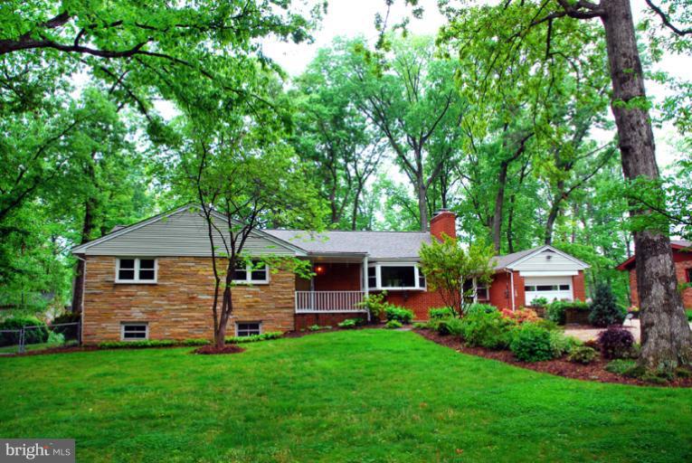 6425 Lignum Street Springfield, VA 22150 - Photo 30 of 30 a front view of a house with a garden
