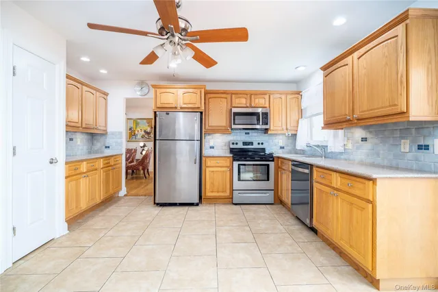 a living room with granite countertop furniture a fireplace with kitchen view