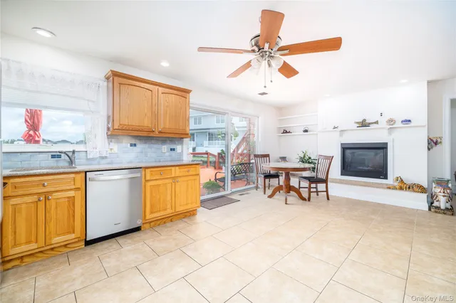 a bathroom with a bathtub sink vanity and mirror