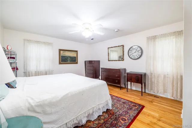 a dining room with a fireplace and a floor to ceiling window
