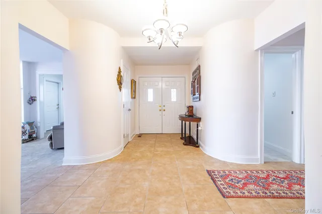 view of an empty room with window and wooden floor