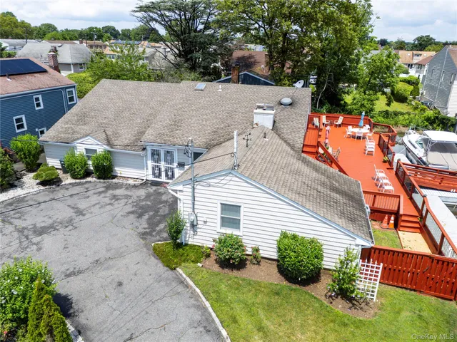 an aerial view of multiple houses with yard