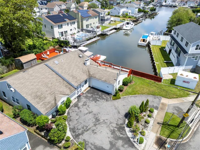 an aerial view of a house with outdoor space