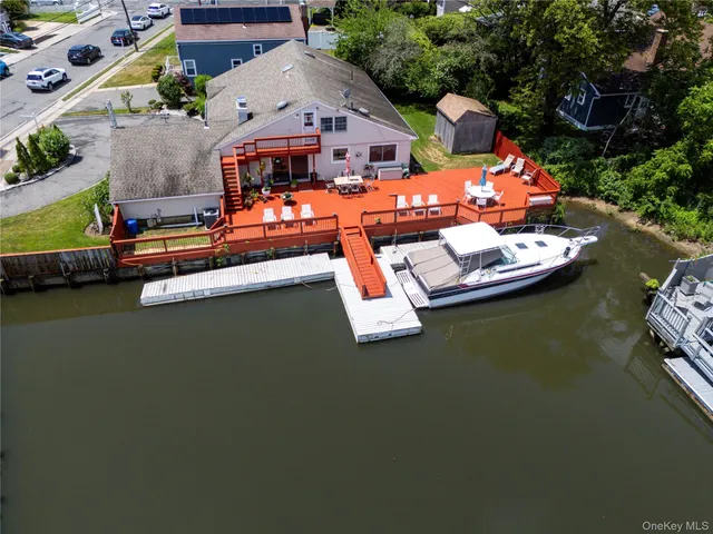 an aerial view of a house with a ocean view