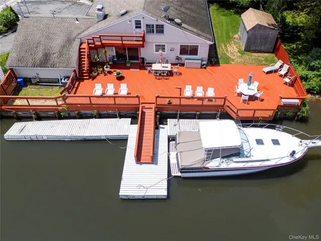 a view of a patio with swimming pool table and chairs
