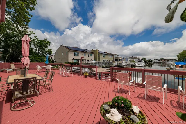 a view of a house with wooden deck