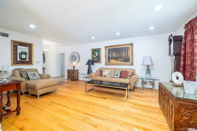 a bathroom with a double vanity sink mirror and toilet