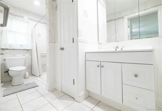 a living room with furniture and a lamp