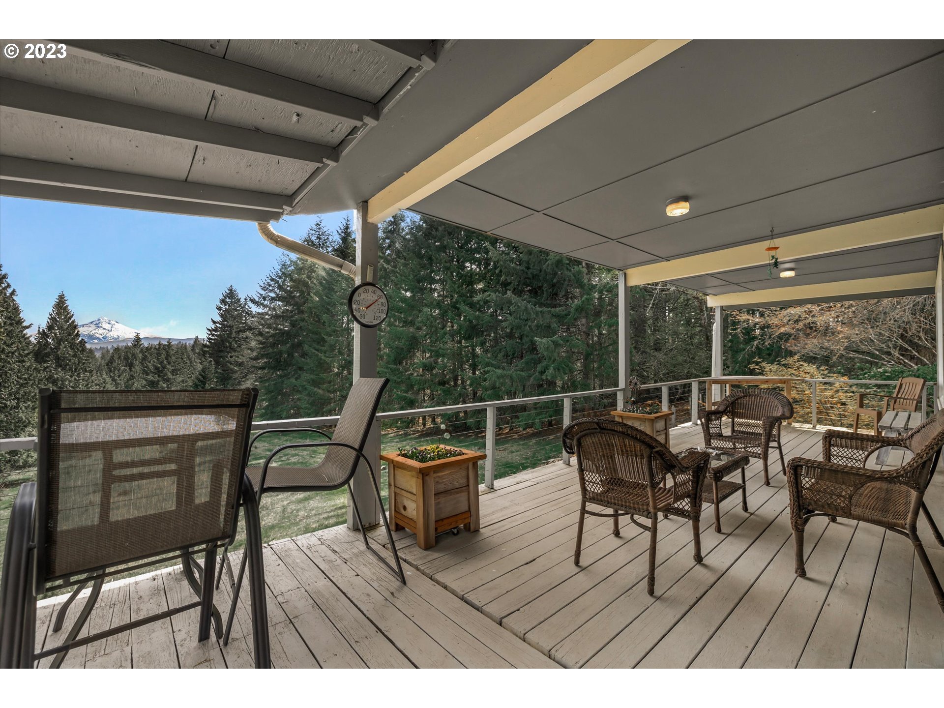44665 Southeast Keisecker Road Sandy, OR 97055 - Photo 28 of 43 a balcony with wooden floor table and chairs