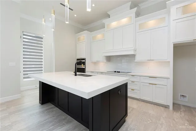 a kitchen with a sink and cabinets
