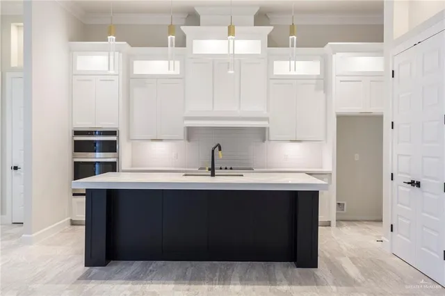 a kitchen with a stove and a refrigerator