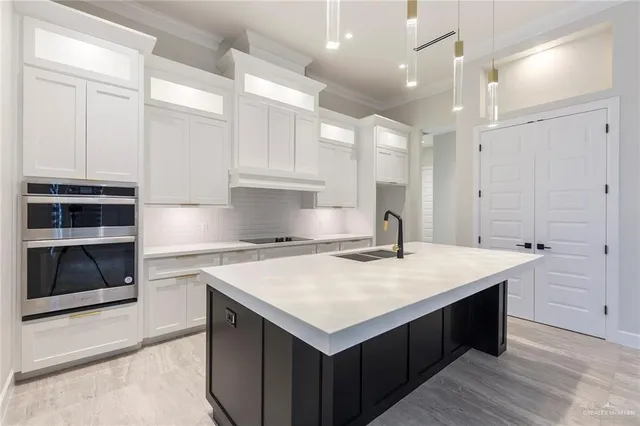 a spacious bathroom with a sink a large mirror and a shower