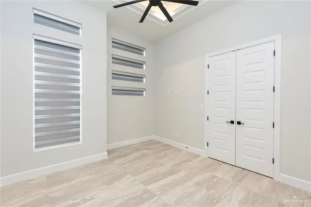 a view of an empty room with a window