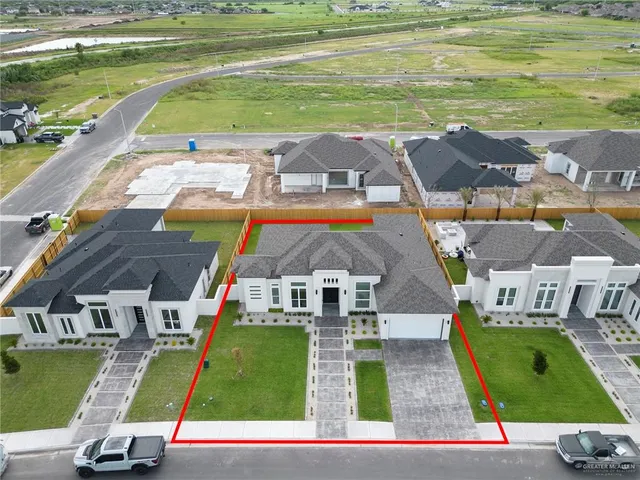an aerial view of a pool a yard swimming pool and outdoor space
