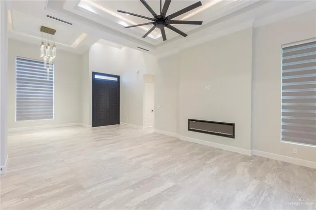 a view of a livingroom with a ceiling fan and window