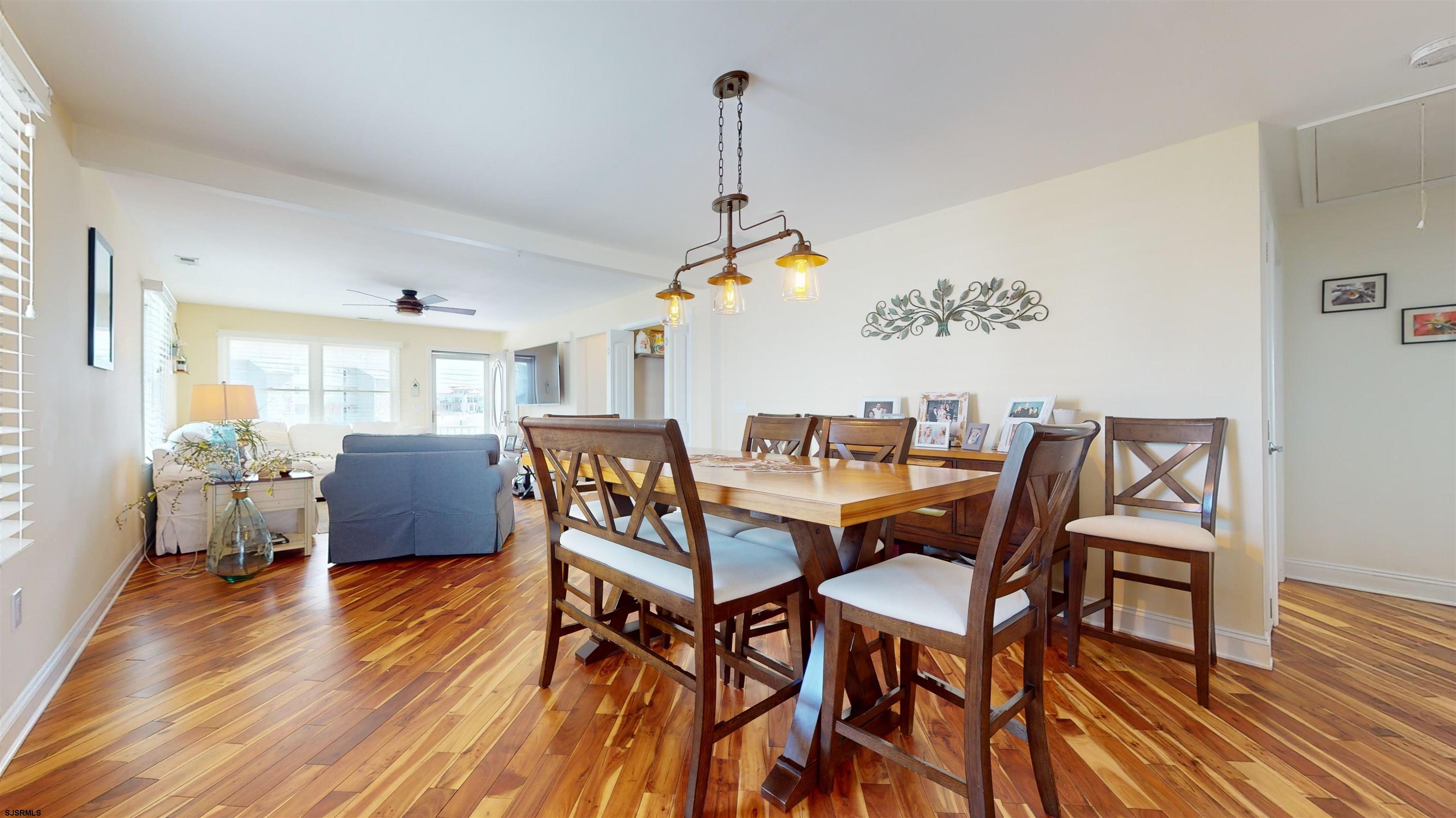 4205 Atlantic Brigantine Boulevard Brigantine, NJ 08203 - Photo 14 of 58 a view of a dining room with furniture and wooden floor