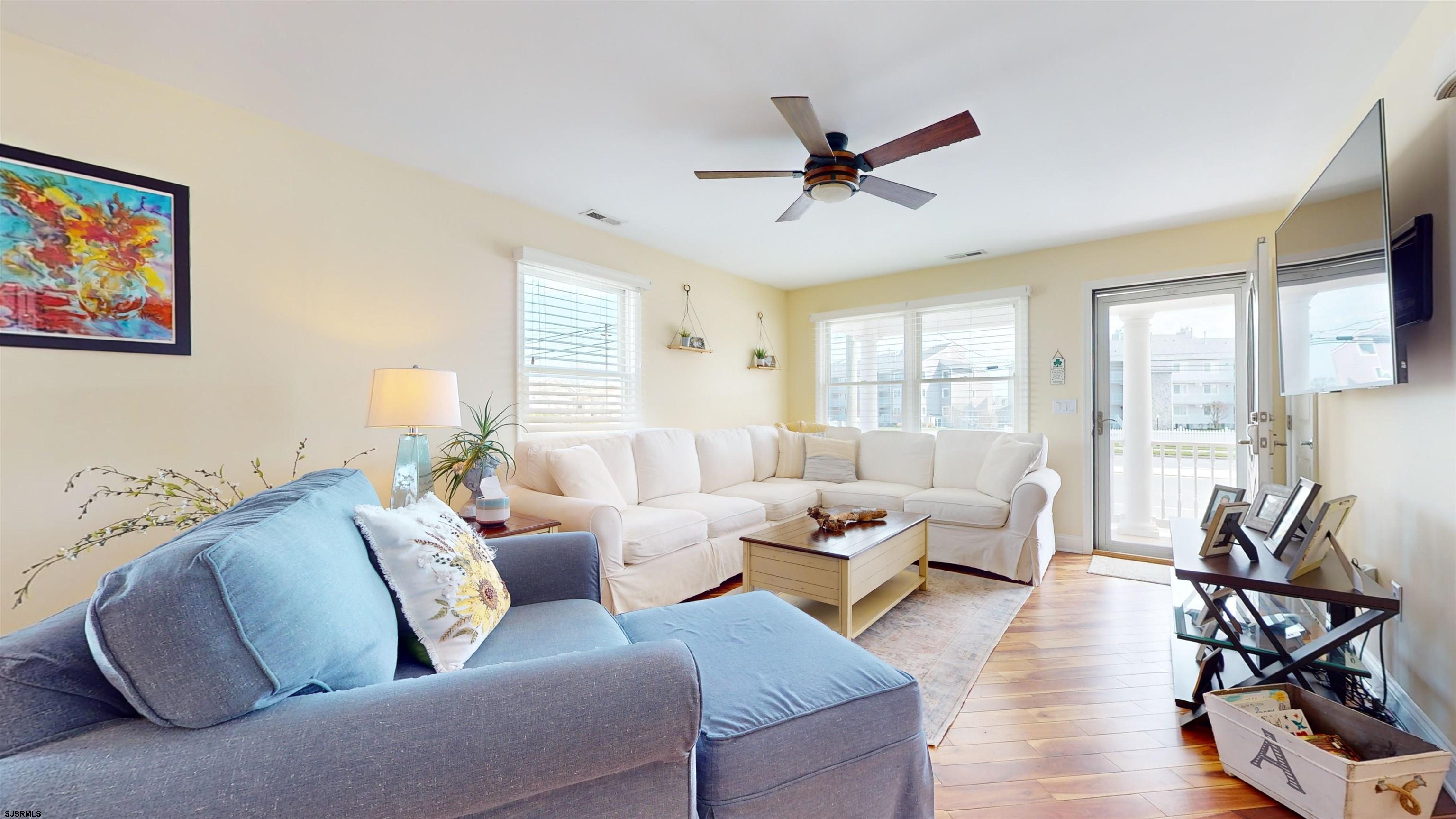 4205 Atlantic Brigantine Boulevard Brigantine, NJ 08203 - Photo 16 of 58 a living room with furniture or window and a flat screen tv
